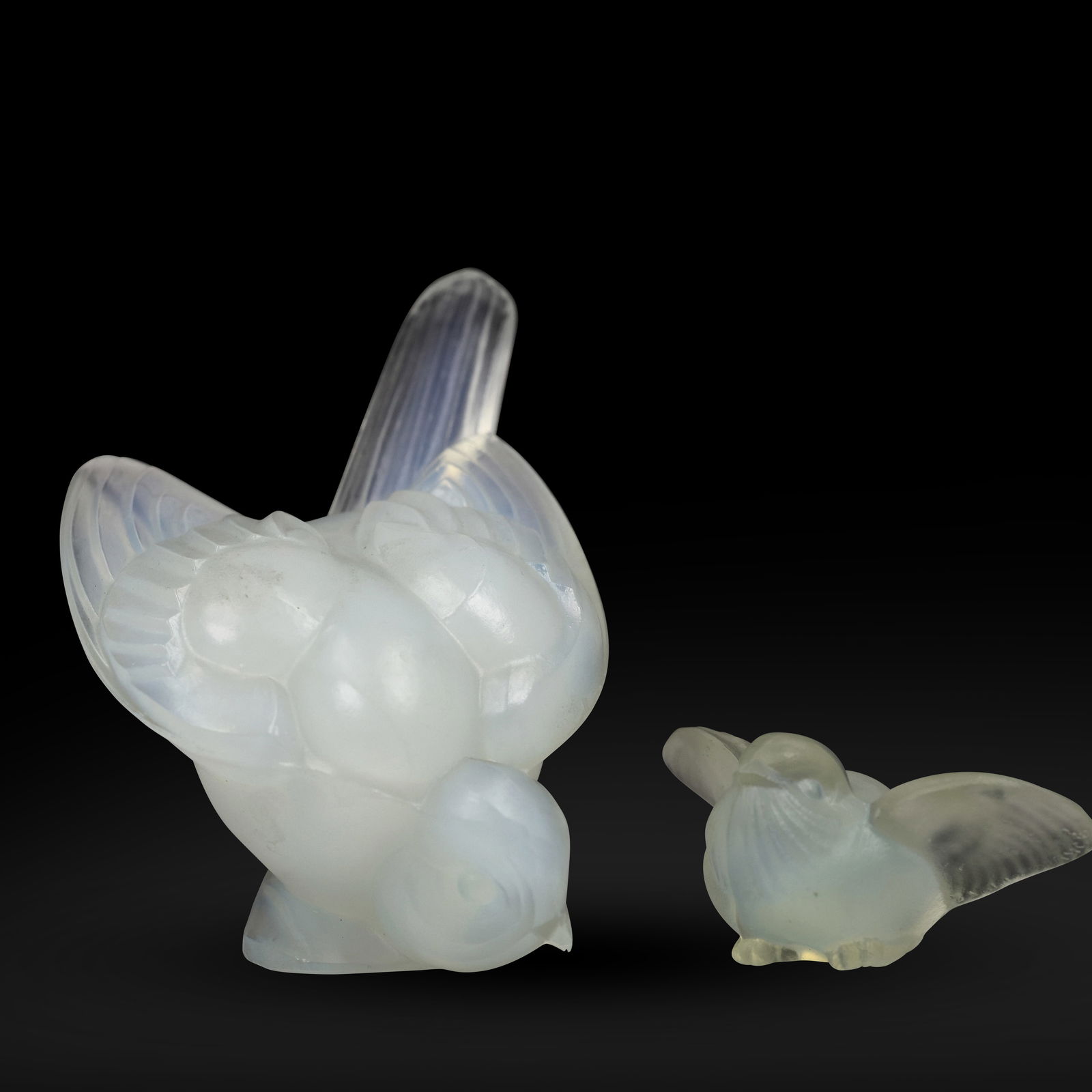 2 opalescent glass bird figurines made by Sabino, each a different size: 2 opalescent glass bird figurines made by Sabino, each a different size. size: 3.5h 3w S:C