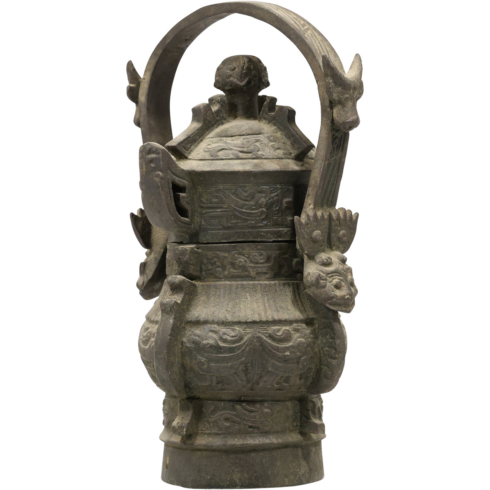 Chinese bronze ritual wine vessel, specifically a gong or you.13 in. height x 7.5 in. wide: Chinese bronze ritual wine vessel, specifically a gong or you. The vessel is a type of lidded wine container. It is often decorated with animal-like masks known as taotie. Vessels like this were used 