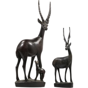 hand-carved teak wooden sculptures of antelopes, likely gazelles, in a mid-century modern style.