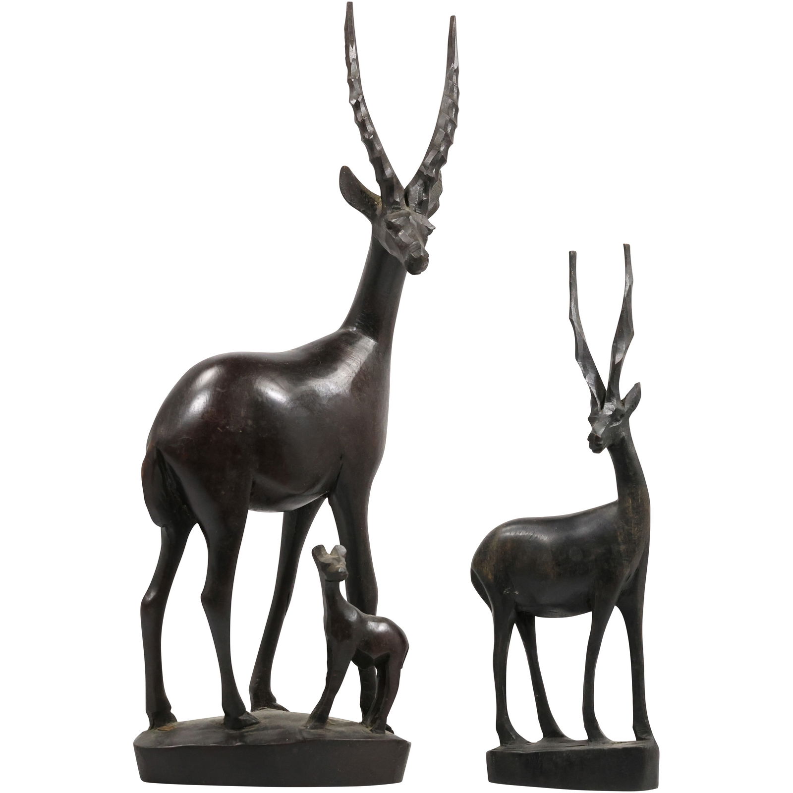 hand-carved teak wooden sculptures of antelopes, likely gazelles, in a mid-century modern style.: hand-carved teak wooden sculptures of antelopes, likely gazelles, in a mid-century modern style. The set includes a large antelope with a fawn and a smaller, individual antelope. size: 27h 6w S:C