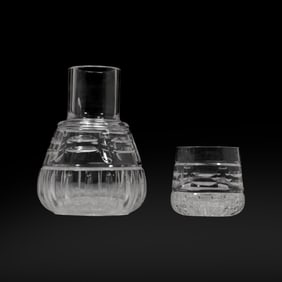 crystal carafe and glass set, also known as a "tumble-up" or bedside water carafe set.
