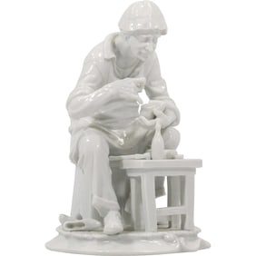 VINTAGE WHITE PORCELAIN FIGURINE OF SHOE MAKER "Cobbler" 9.5 in. height x 6.75 in. wide