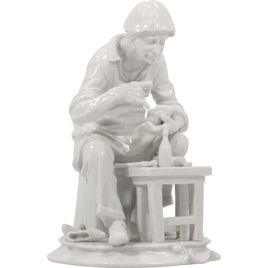 VINTAGE WHITE PORCELAIN FIGURINE OF SHOE MAKER "Cobbler" 9.5 in. height x 6.75 in. wide: " This item requires an appointment scheduled via email (donny@donnymaloneauctions.com) at least 24 hours before pick-up. VINTAGE WHITE PORCELAIN FIGURINE OF SHOE MAKER ""Cobbler"" 9.5 in. height x 6.