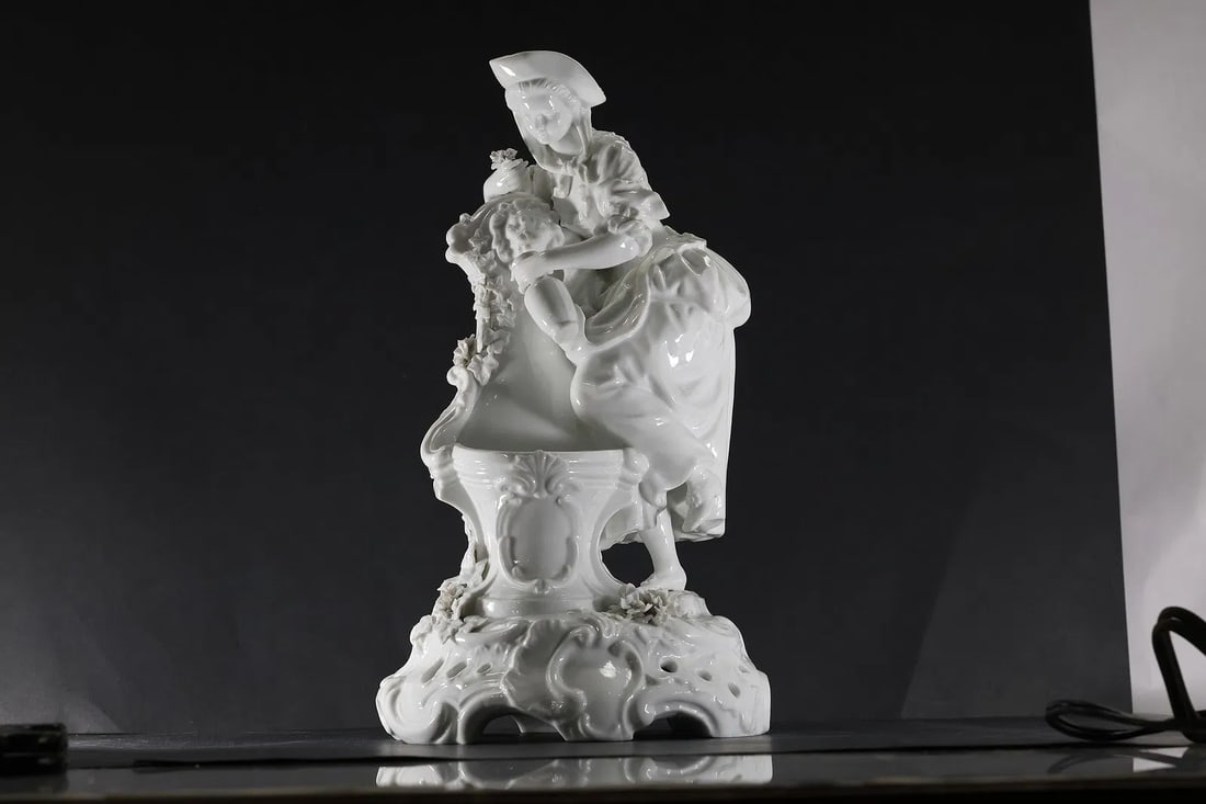 19th C. Dresden White Glazed Porcelain Grouping of a Classical Woman Next to Fountain 14 in. h.: " This item requires an appointment scheduled via email (donny@donnymaloneauctions.com) at least 24 hours before pick-up. 19th C. Dresden White Glazed Porcelain Grouping of a Classical Woman Next to F