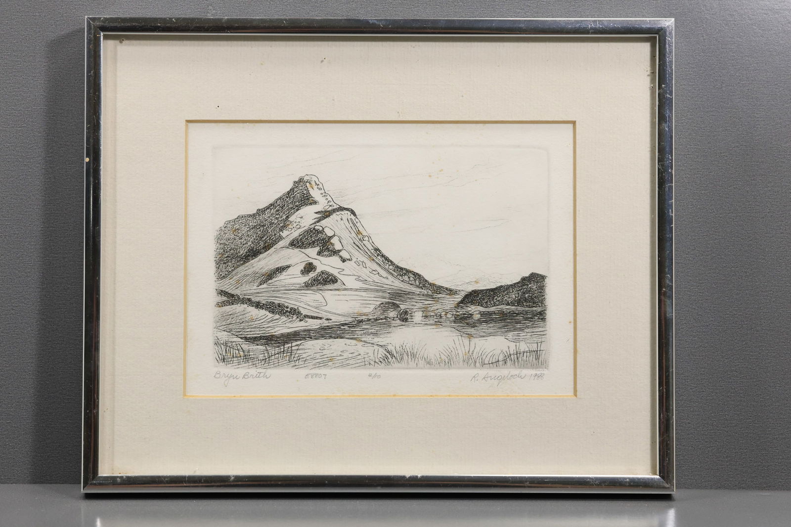Robert Angeloch (1922–2011) – “Bryn Brith” – Etching and Drypoint, 1988: All descriptions were generated using AI technology and have not been reviewed or verified by a human. All items are sold as-is, where-is. It is the buyer’s responsibility to preview, examine, and a