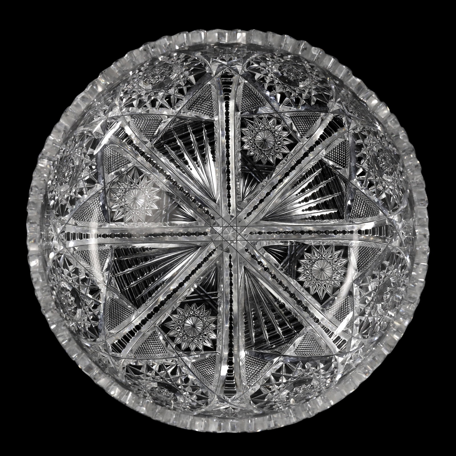 American Brilliant Cut Glass Bowl with Starburst and Fan Motifs, 9 in. dia.: Antique clear cut glass bowl featuring a complex geometric design characteristic of the American Brilliant Period. The pattern includes radiating starbursts, hobstars, cross-hatching, and fan cuts arr