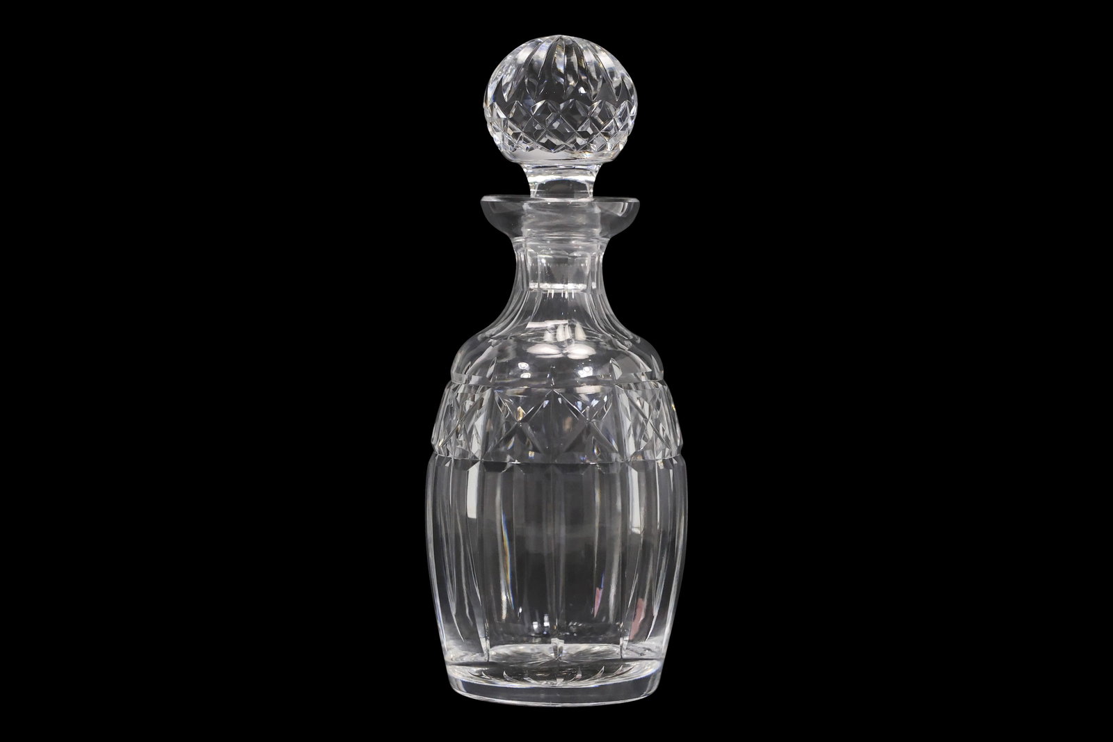 Signed Waterford Crystal Kylemore Cut Glass Decanter: Signed Waterford crystal decanter in the Kylemore pattern, featuring a faceted globe stopper and diamond-cut banding over fluted lower panels. Etched Waterford mark on the base. This design showcases
