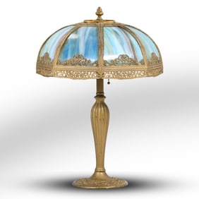 Signed Antique Curved slag glass and patinated metal table lamp with 8 blue panels, 22 in. height