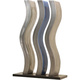 Sculpture featuring three abstract, wave-like vertical forms on a black marble base. "Bright Water"