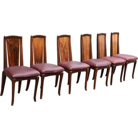 Set of six mid-century rosewood and leather dining chairs in the style of Nakashima.