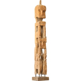 wooden figure known as a nuchu, which is a type of carved figure made by the Guna (or Kuna) people