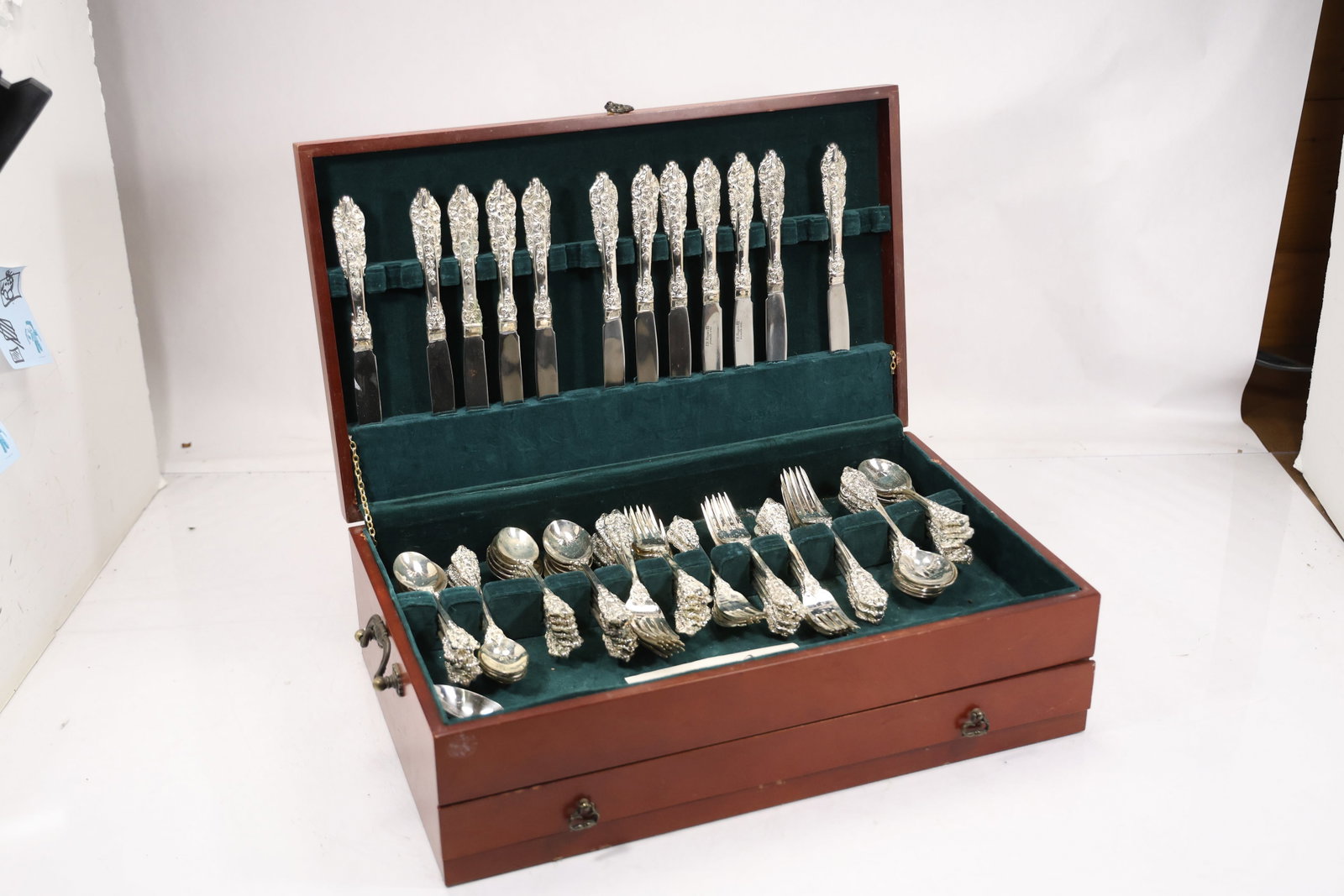 Vintage F B Rogers Ornate Rose Pattern Stainless Steel Flatware Set: Vintage F B Rogers stainless steel flatware set featuring heavily embossed rose floral and foliate handles. The assembled set includes assorted dinner knives forks tablespoons teaspoons and serving ut