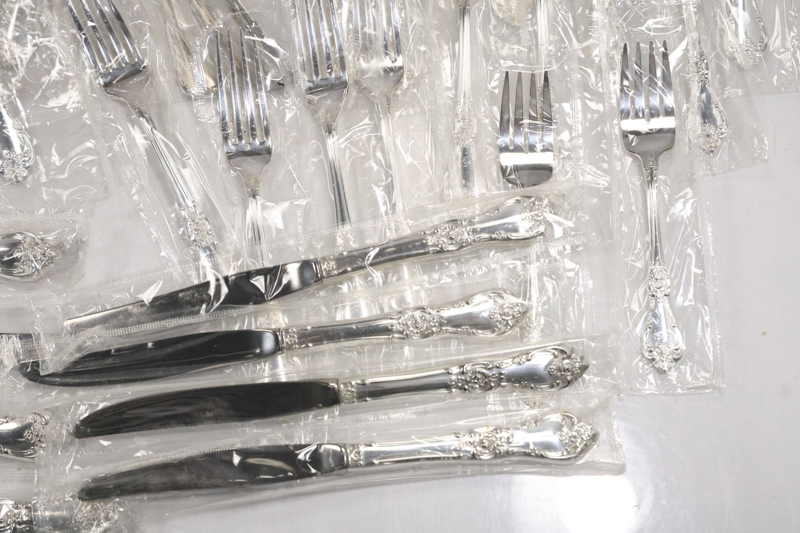 Large Unmarked Floral Pattern Silver Tone Flatware Set - 10