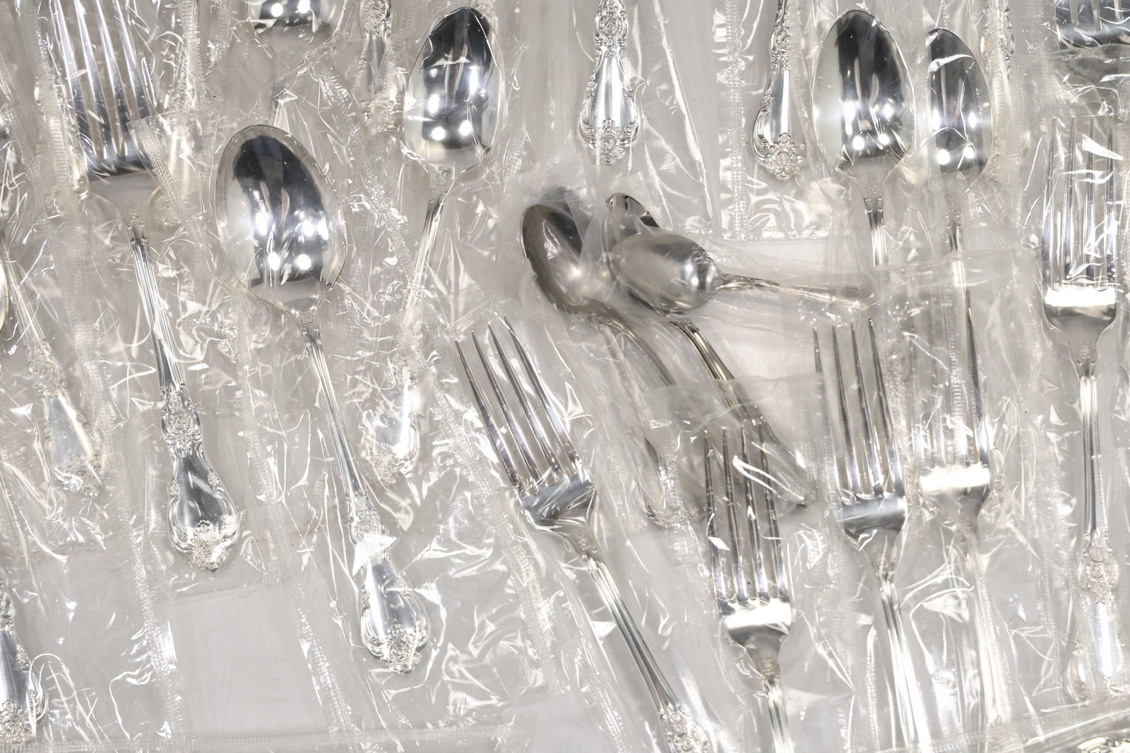 Large Unmarked Floral Pattern Silver Tone Flatware Set - 11