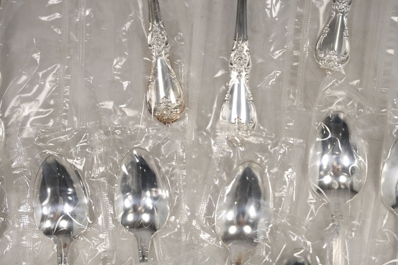 Large Unmarked Floral Pattern Silver Tone Flatware Set - 12