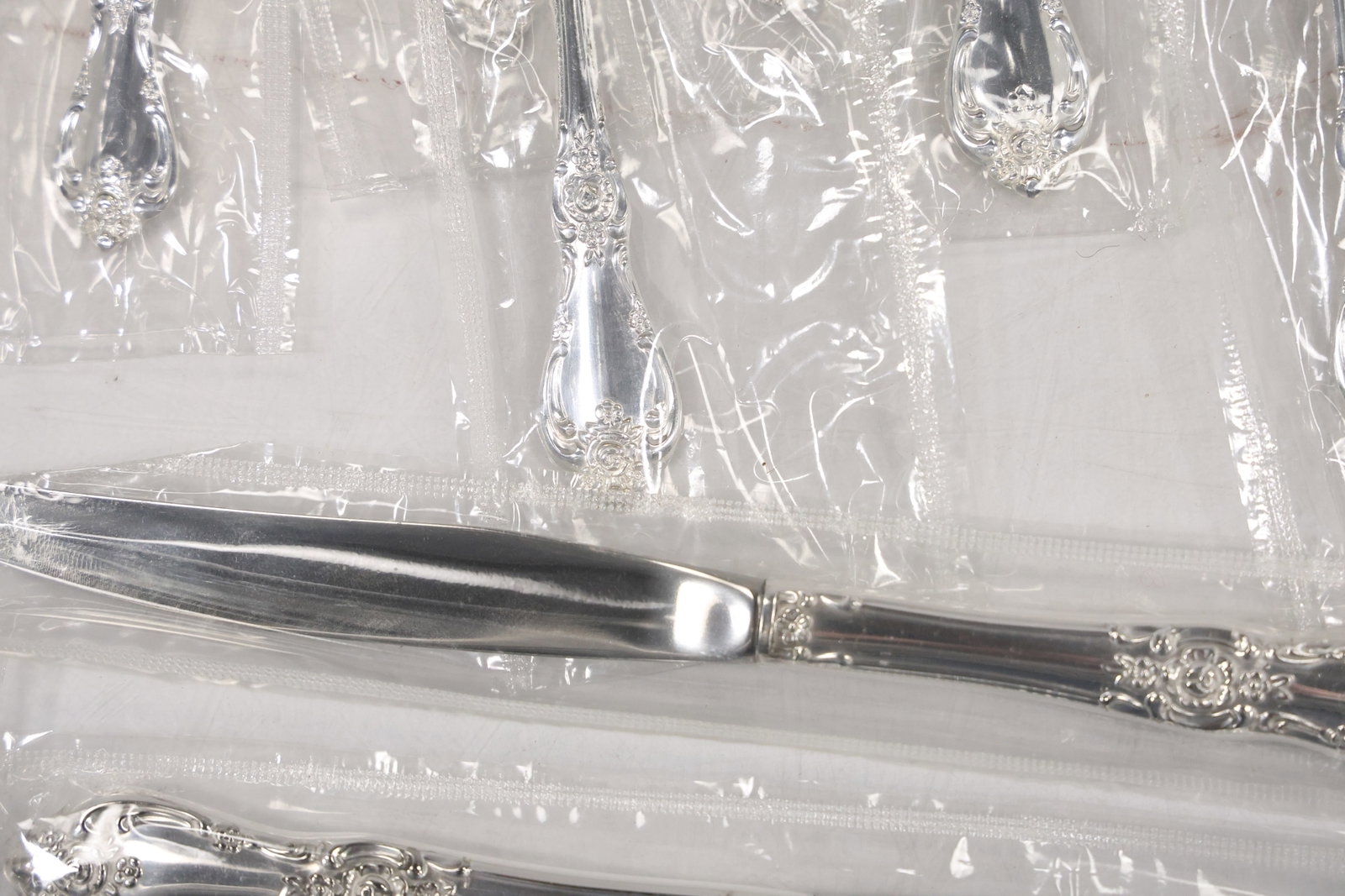 Large Unmarked Floral Pattern Silver Tone Flatware Set - 14