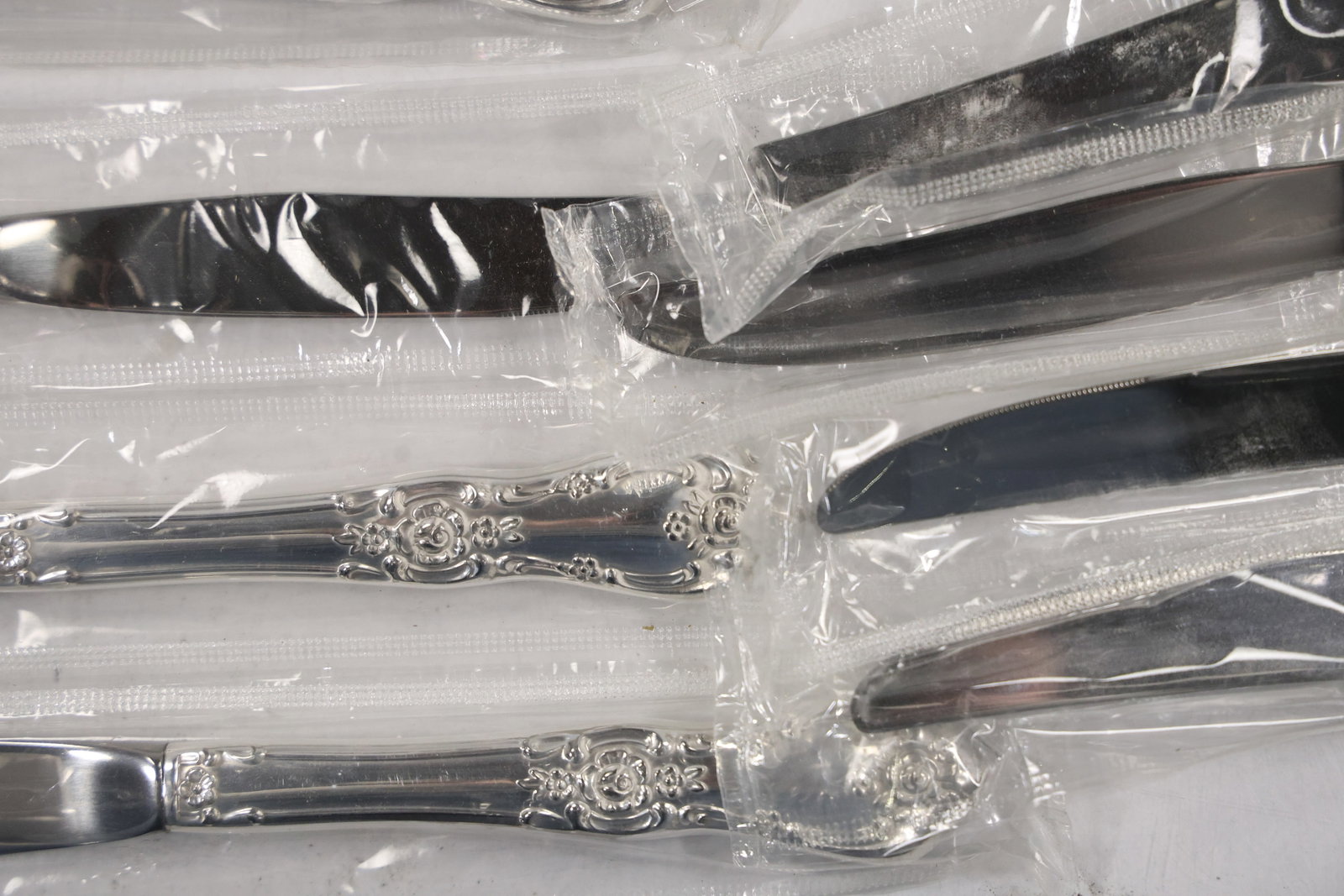 Large Unmarked Floral Pattern Silver Tone Flatware Set - 15