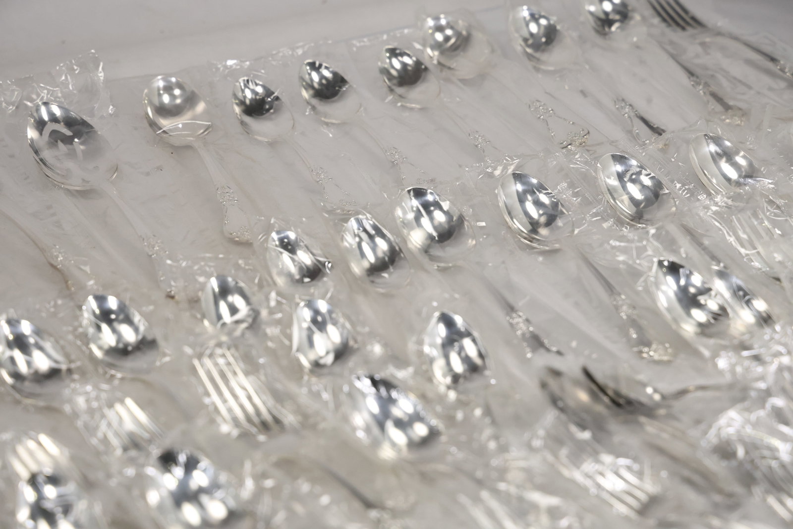 Large Unmarked Floral Pattern Silver Tone Flatware Set - 17