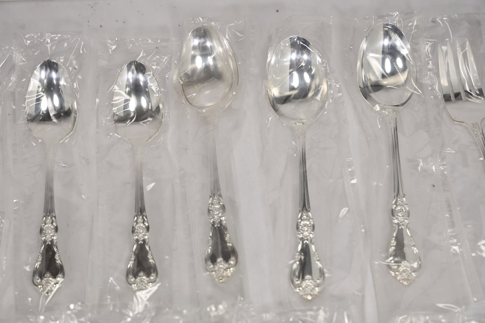Large Unmarked Floral Pattern Silver Tone Flatware Set - 4
