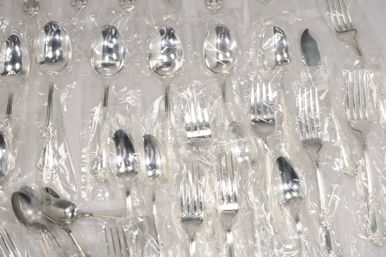 Large Unmarked Floral Pattern Silver Tone Flatware Set - 5