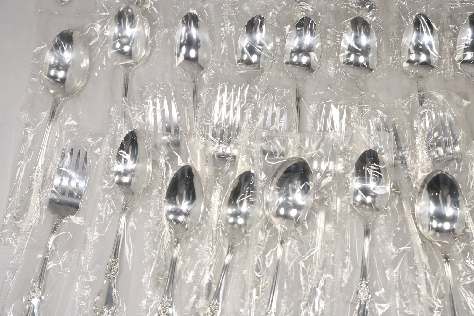 Large Unmarked Floral Pattern Silver Tone Flatware Set - 7