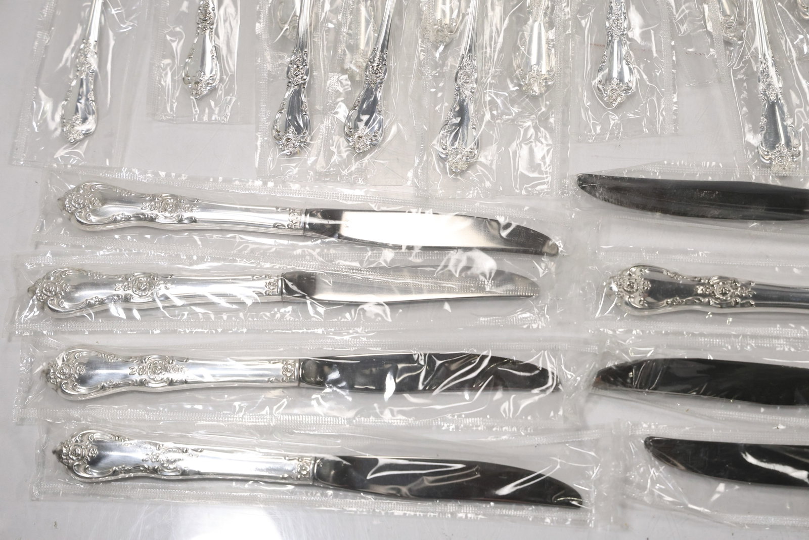 Large Unmarked Floral Pattern Silver Tone Flatware Set - 8