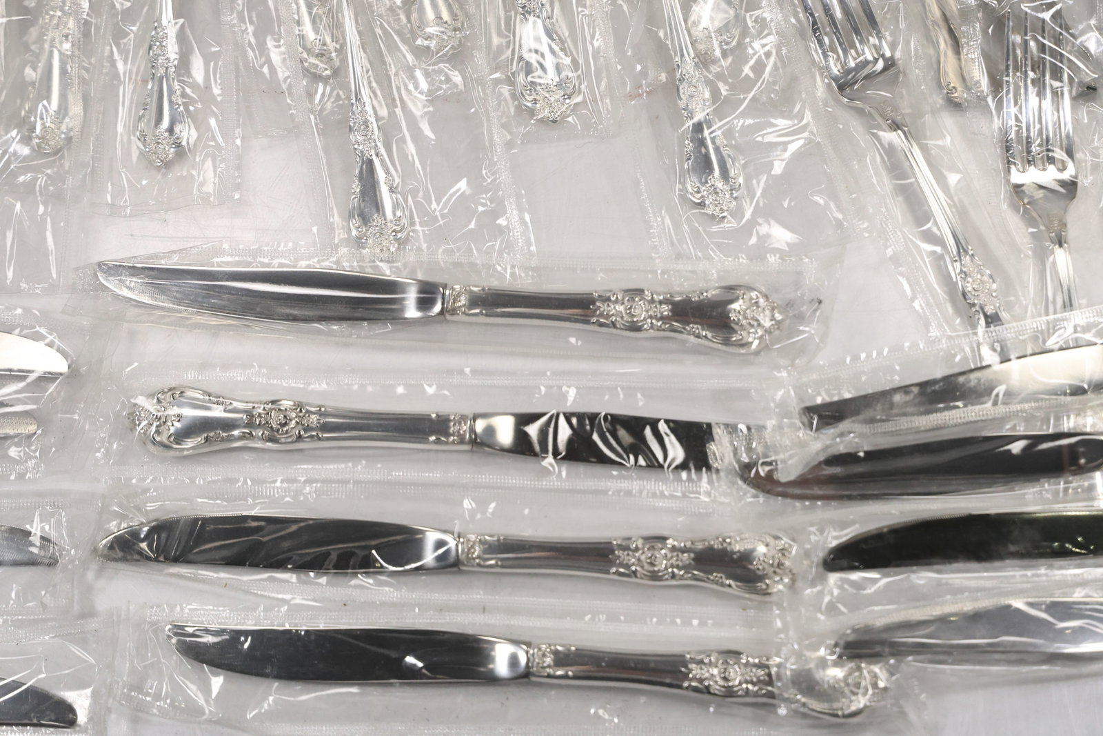 Large Unmarked Floral Pattern Silver Tone Flatware Set - 9