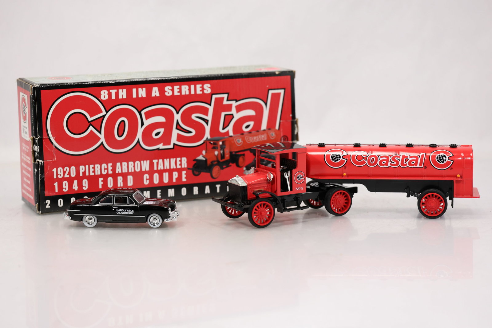 Ertl Coastal Oil Co. 1920 Pierce Arrow Tanker & 1949 Ford Coupe Die-Cast Set: Limited-edition die-cast collector's set featuring a 1920 Pierce Arrow tanker truck paired with a 1949 Ford Coupe, produced as the 8th in the Coastal series. The set showcases a bright red Coastal-bra