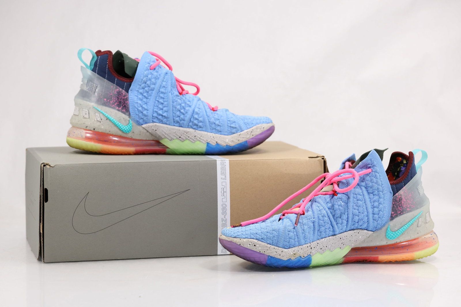 Nike Multicolor High Top Sneakers Mens Size 9.5: Pair of Nike mens high top sneakers in blue pink black and multicolor textile and synthetic materials. The shoes include lace closures padded collars rubber soles and a Nike shoe box. The layered colo
