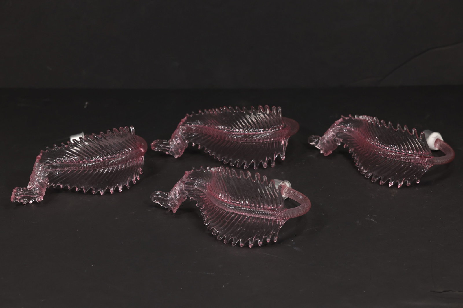 Set of Four Pink Murano Glass Leaf Chandelier Parts: Set of four vintage mid century Murano glass pink foliage chandelier replacement parts from confirmed importer stock. Each curved element has a ribbed leaf body serrated perimeter and saturated transl