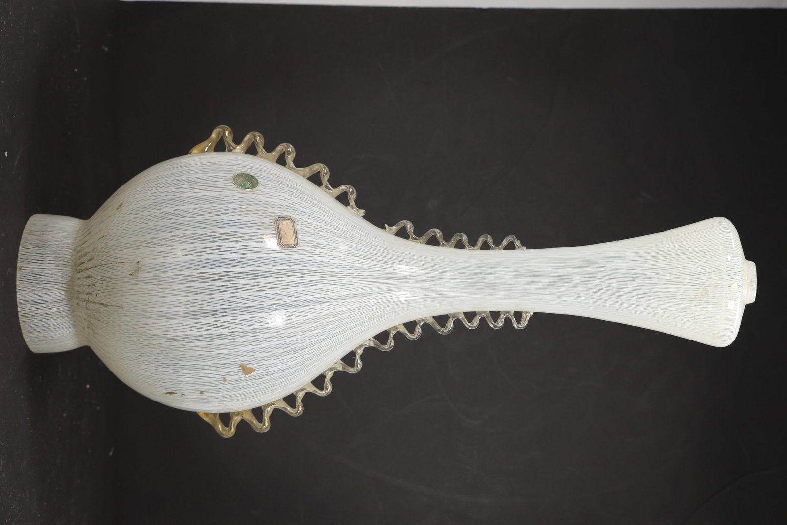 White Ribbed Murano Glass Chandelier Column Shade: Single vintage mid century Murano glass white elongated chandelier column or shade from confirmed importer stock. The tall opaline component has a tapered ribbed body flared upper section and narrow m