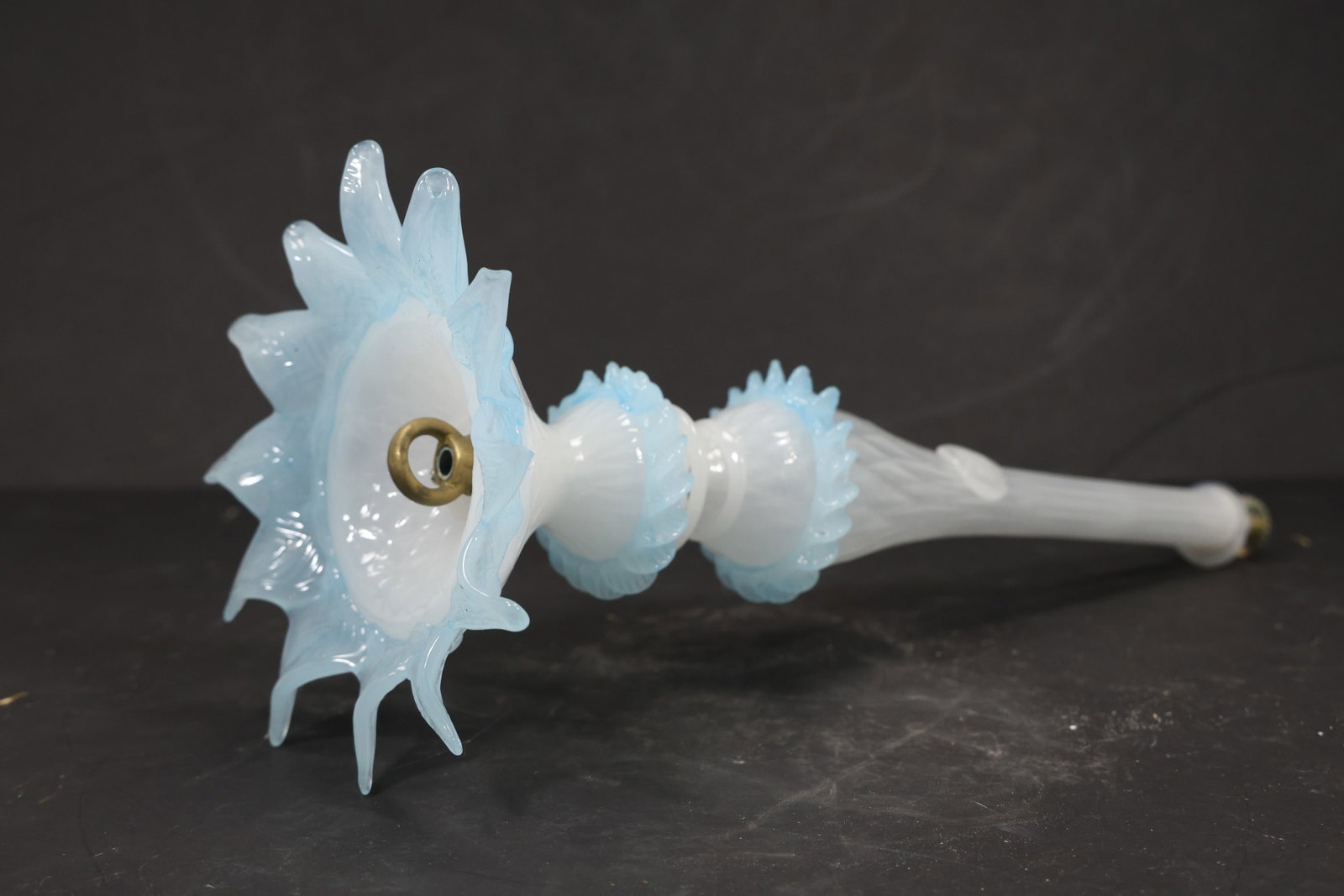 Blue and White Murano Glass Floral Chandelier Stem: Single vintage mid century Murano glass decorative floral chandelier stem from confirmed importer stock. Photographs show an elongated body with a flower form and tapered mounting end in blue and whit