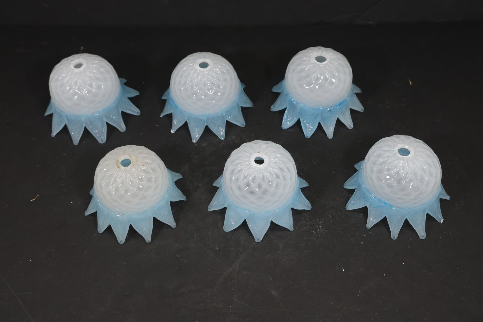 Set of Six Blue and White Murano Glass Chandelier Shades: Set of Six vintage mid century Murano glass chandelier shades from confirmed importer stock. Photographs show flared or domed bodies with central apertures and decorative rims in blue and white tones.