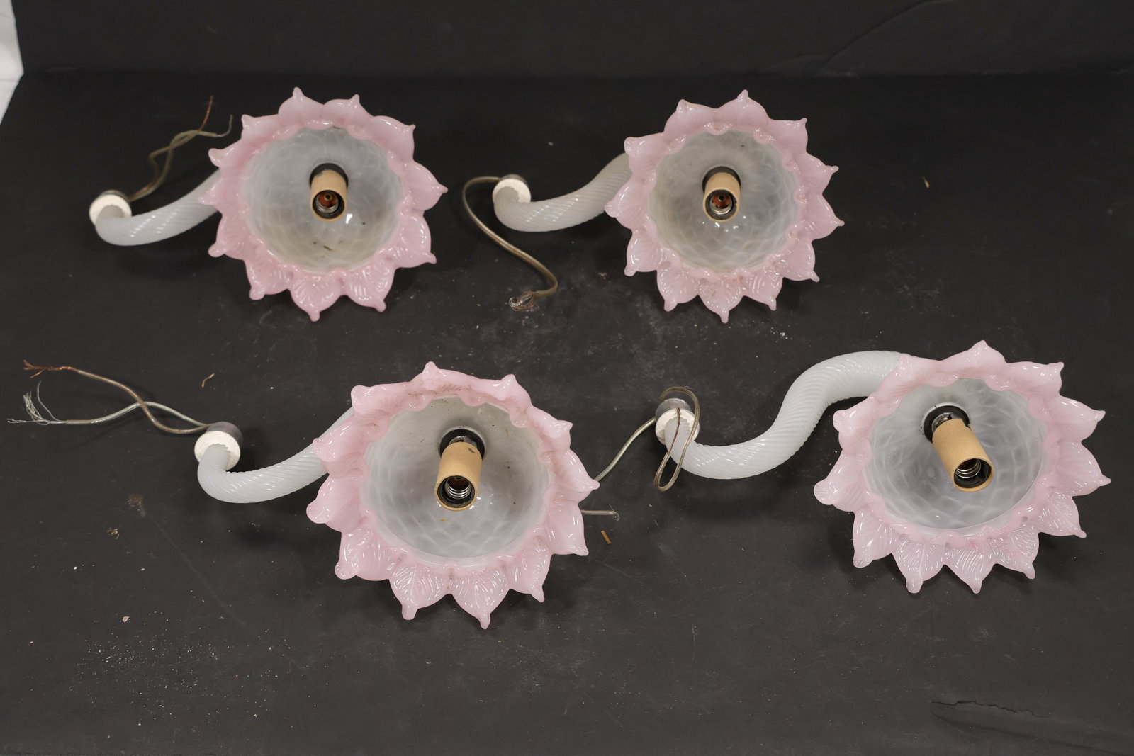 Set of Four Pink and White Murano Glass Flower Chandelier Stems: Set of Four vintage mid century Murano glass flower chandelier stems from confirmed importer stock. Photographs show curved or straight supports ending in layered blossoms with modeled petals in pink 