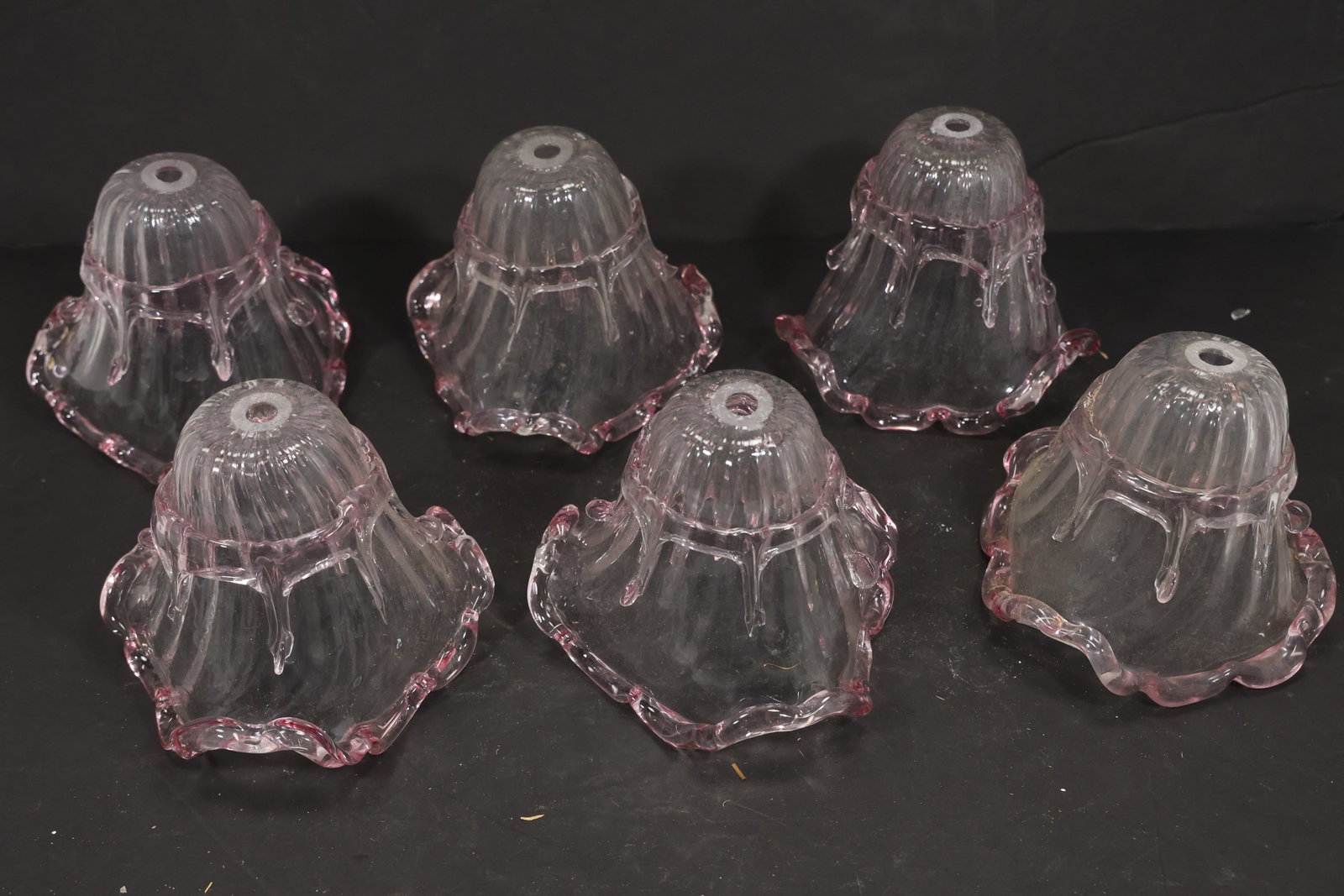 Set of Six Clear and Pink Murano Glass Chandelier Shades: Set of Six vintage mid century Murano glass chandelier shades from confirmed importer stock. Photographs show flared or domed bodies with central apertures and decorative rims in clear and pink tones.