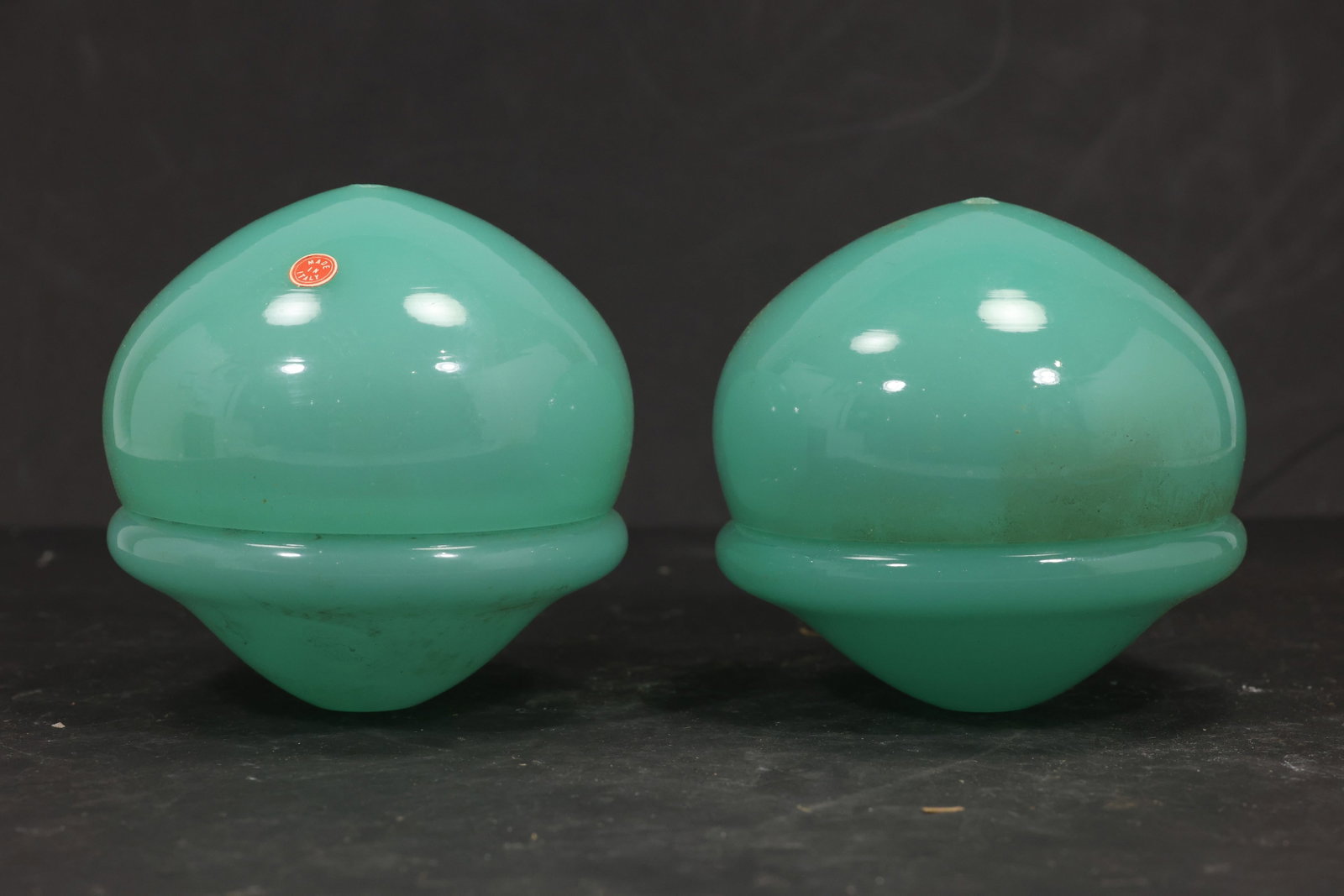 Pair Cyan Murano Glass Domed Chandelier Covers: Pair of vintage mid century Murano glass rounded domed chandelier covers from confirmed importer stock. Photographs show smooth spherical bodies with raised equatorial ribs and open undersides in cyan