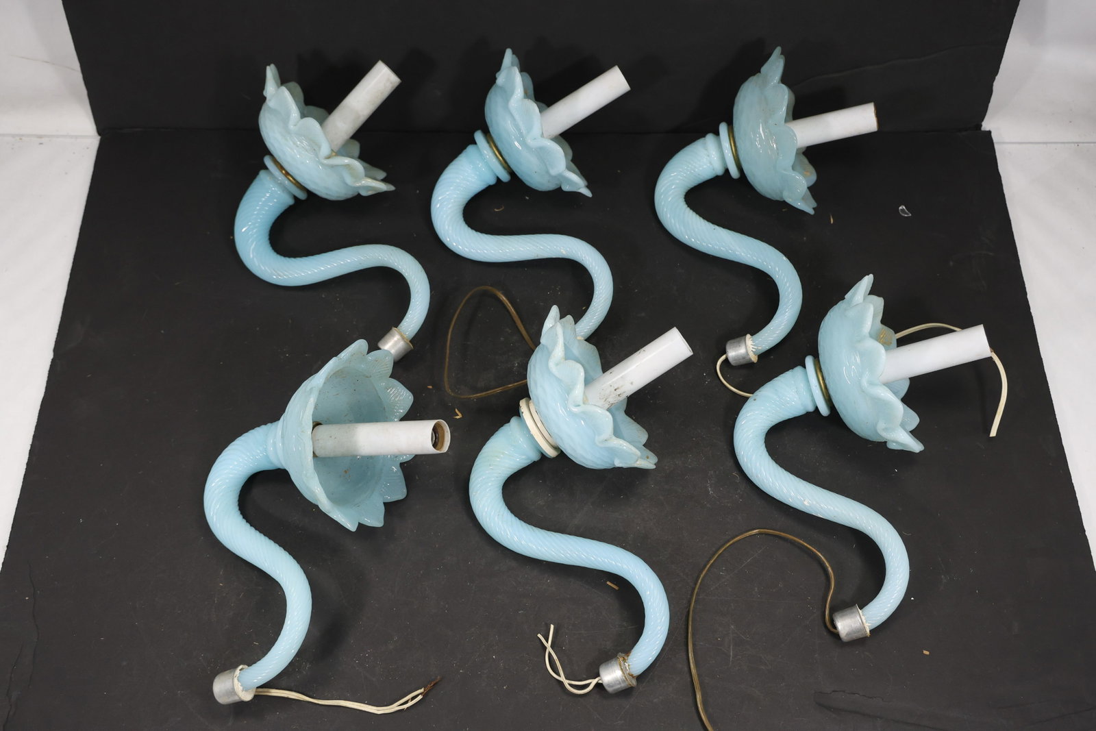 Set of Six Blue Murano Glass Flower Chandelier Stems: Set of Six vintage mid century Murano glass flower chandelier stems from confirmed importer stock. Photographs show curved or straight supports ending in layered blossoms with modeled petals in blue t