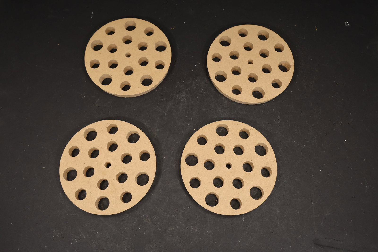 Set of Four Gold Tone Chandelier Mounting Discs: Set of Four vintage mid century perforated metal chandelier mounting discs from confirmed Murano lighting importer stock. Photographs show round gold tone plates with evenly spaced holes for glass ste