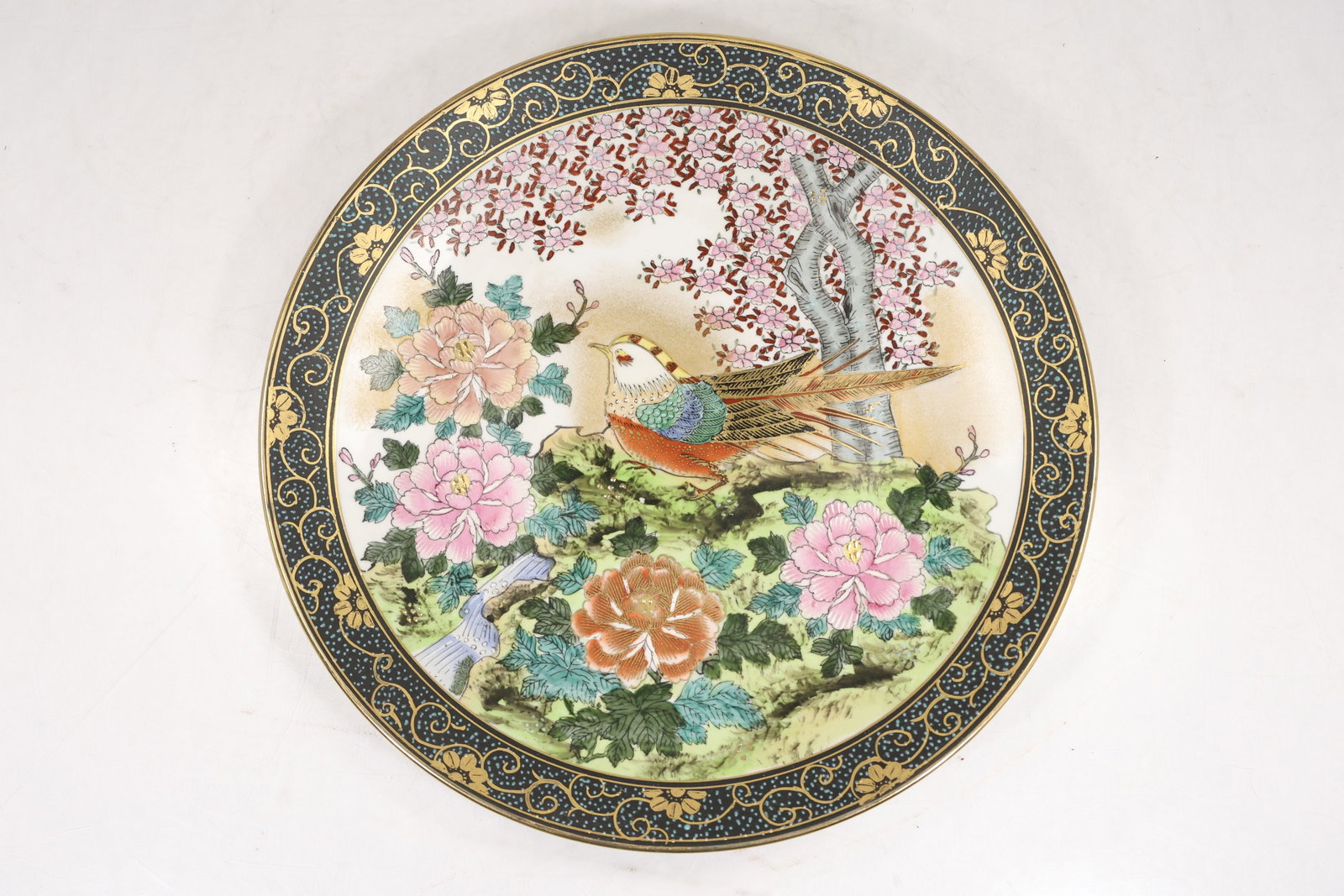 Satsuma Hand Painted Decorative Charger with Pheasant and Floral Motif: Large decorative porcelain charger hand painted with a colorful scene depicting a pheasant perched among flowering plants and foliage. The border is richly decorated with gilt scrolling ornament again