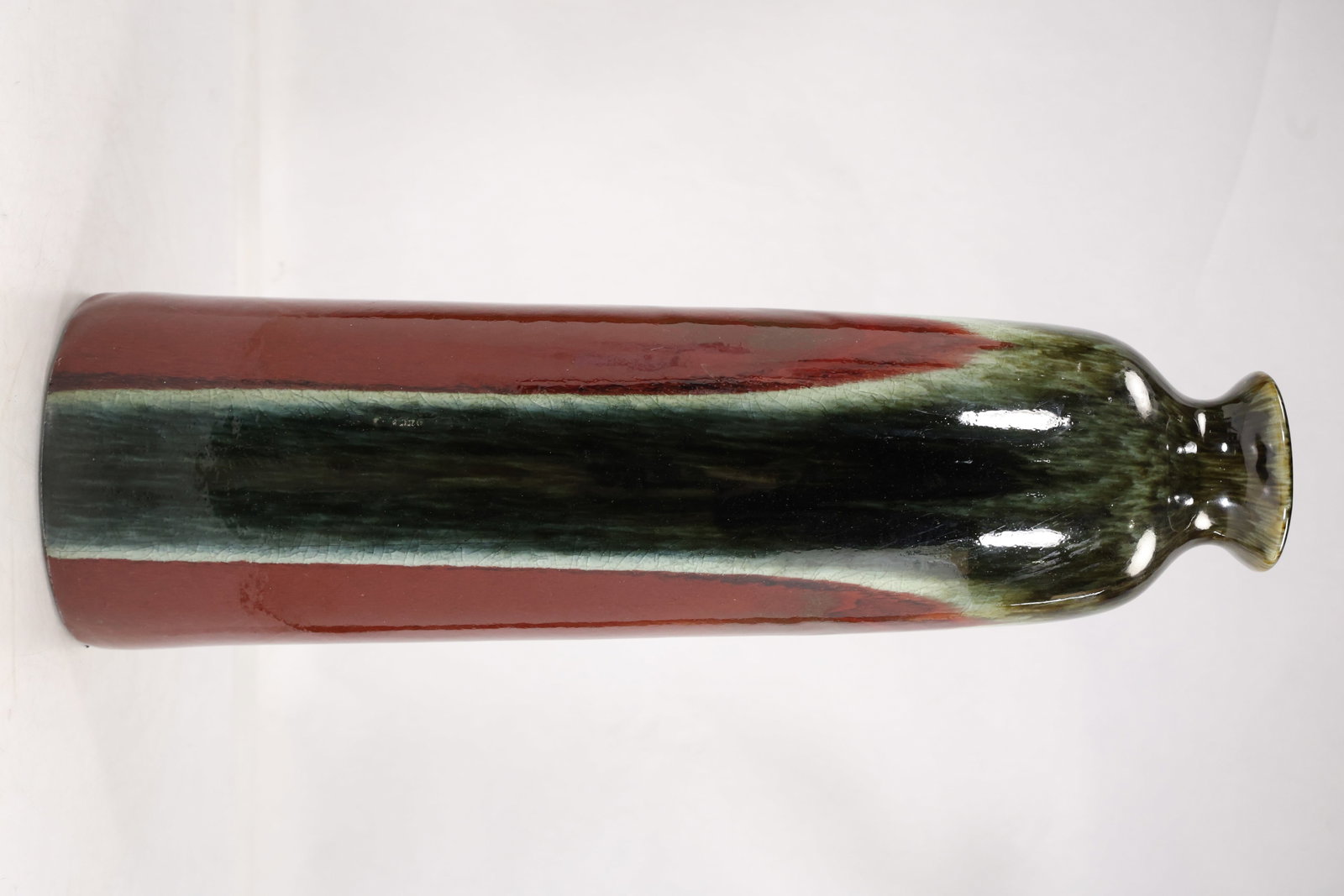 Tall Modern Pottery Flambe Glazed Vase: Tall Modern Pottery Flambe Glazed Vase size: 21h 6w S:F** Important Auction information:**** All lot descriptions in this auction were generated using artificial intelligence piloting innovative techn