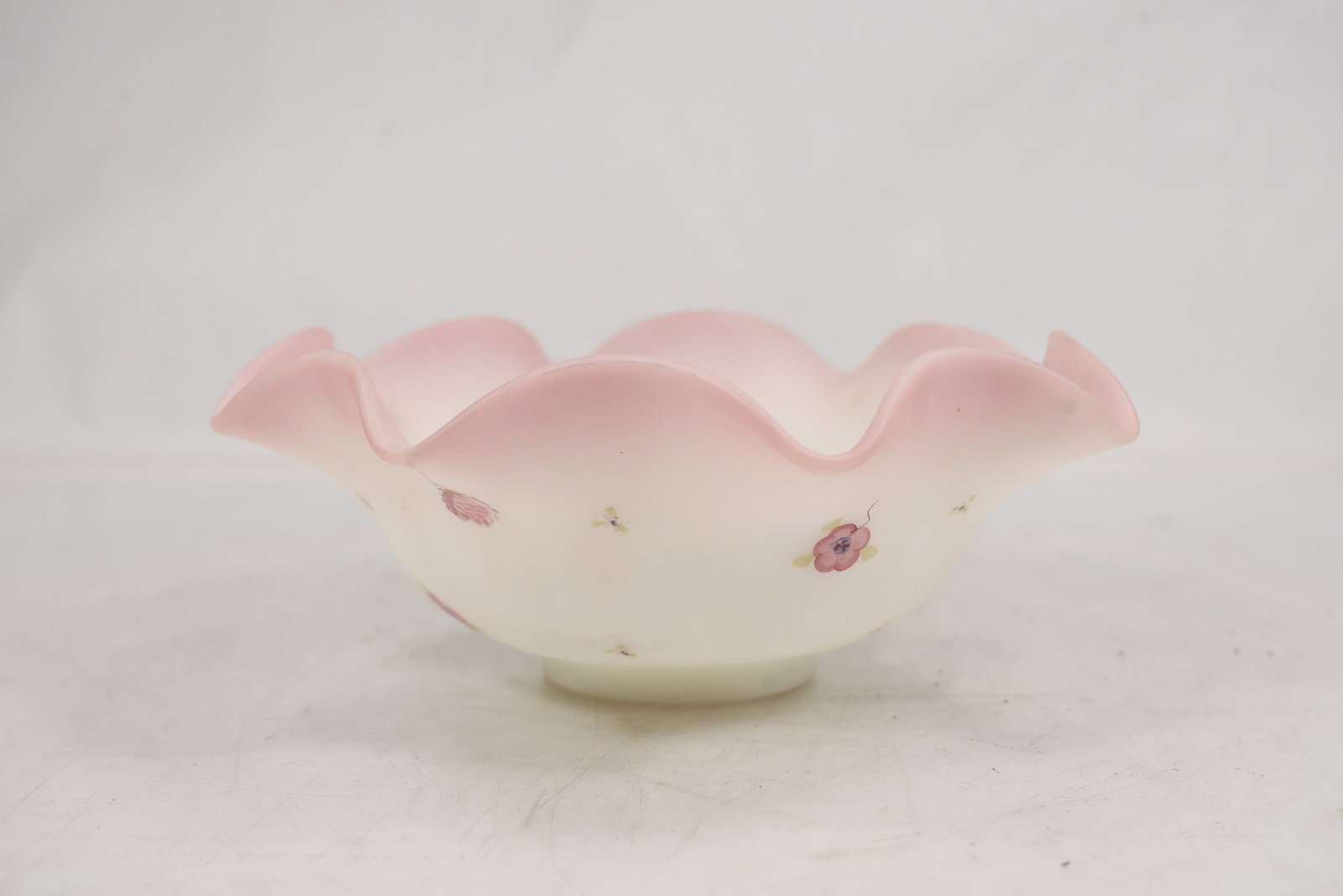 Fenton Berries And Blossoms Burmese Satin Glass Bowl Hand Painted: Fenton Berries And Blossoms Burmese Satin Glass Bowl Hand Painted size: 3.5h 9.5w S:G** Important Auction information:**** All lot descriptions in this auction were generated using artificial