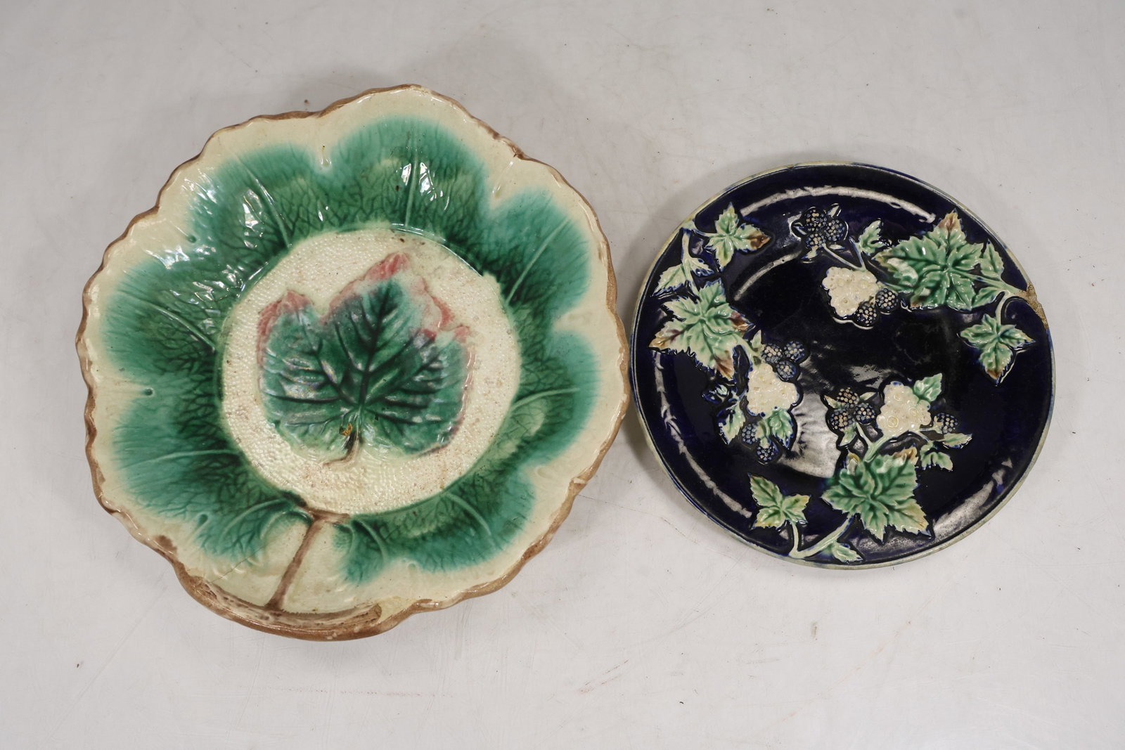 2 Majolica Pottery Leaf Plates: 2 Majolica Pottery Leaf Plates size: 2h 10w S:G** Important Auction information:**** All lot descriptions in this auction were generated using artificial intelligence piloting innovative technologies 