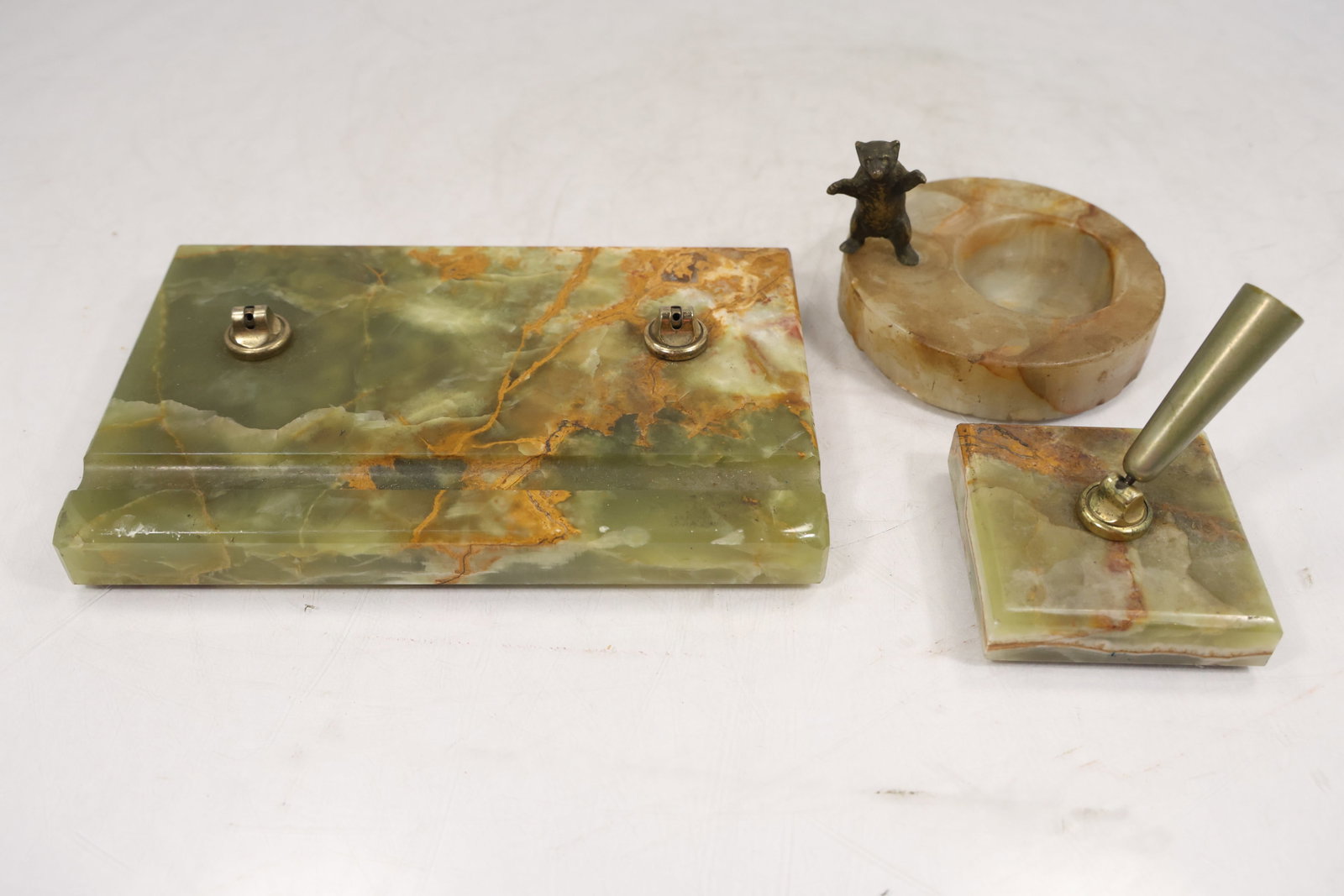 Vintage Green Onyx Desk Set – 3 Piece (Pen Base, Tray, Ashtray): Three-piece desk set crafted from polished green onyx, featuring natural veining in shades of cream, amber, and rust. Set includes a pen holder base, rectangular desk tray, and matching ashtray with a