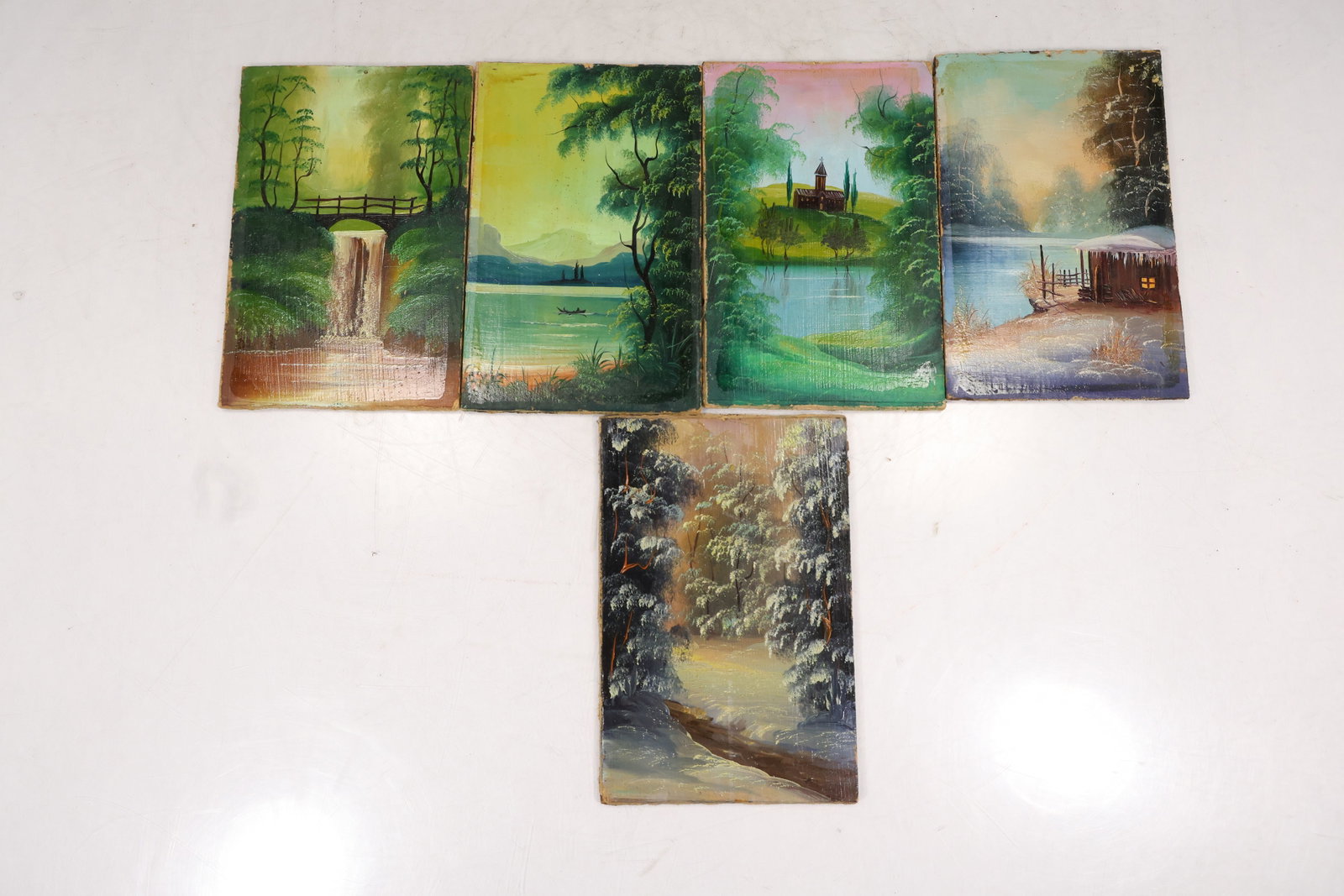 Group of Five Small 1990 Landscape Paintings on Panel: Group of five small landscape paintings on rectangular prepared panels. Subjects include a waterfall in a wooded setting a lake with distant mountains a church or monastery beside water a winter cabin
