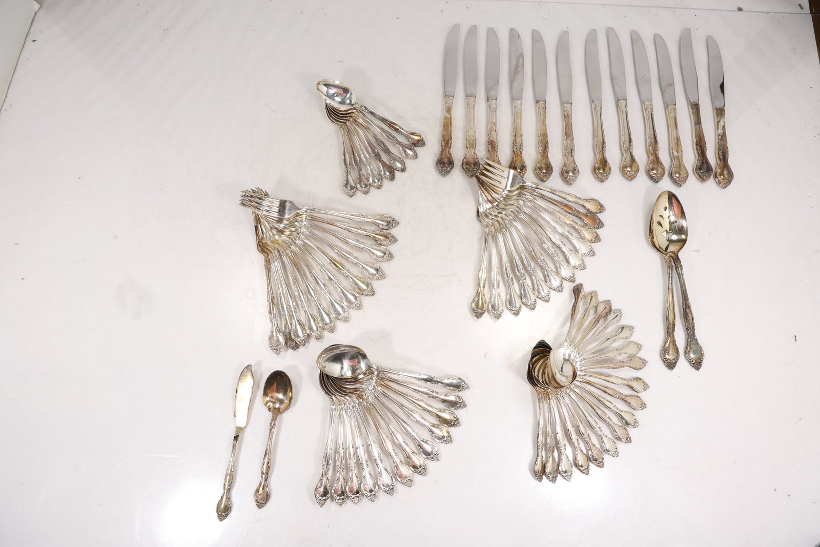 Large Unmarked Silver Tone Flatware Service with Floral Scroll Pattern (1 of 15)