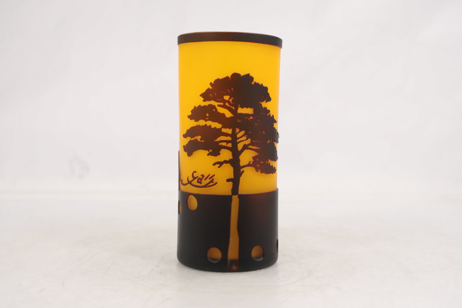 Gallé Style Safari Wildlife Art Glass Cylinder Candle Holder or Lamp Shade: Frosted amber-colored art glass cylinder featuring a black cameo-style decoration of giraffes and an acacia tree in an African safari landscape. The piece bears a Gallé-style signature and is execute
