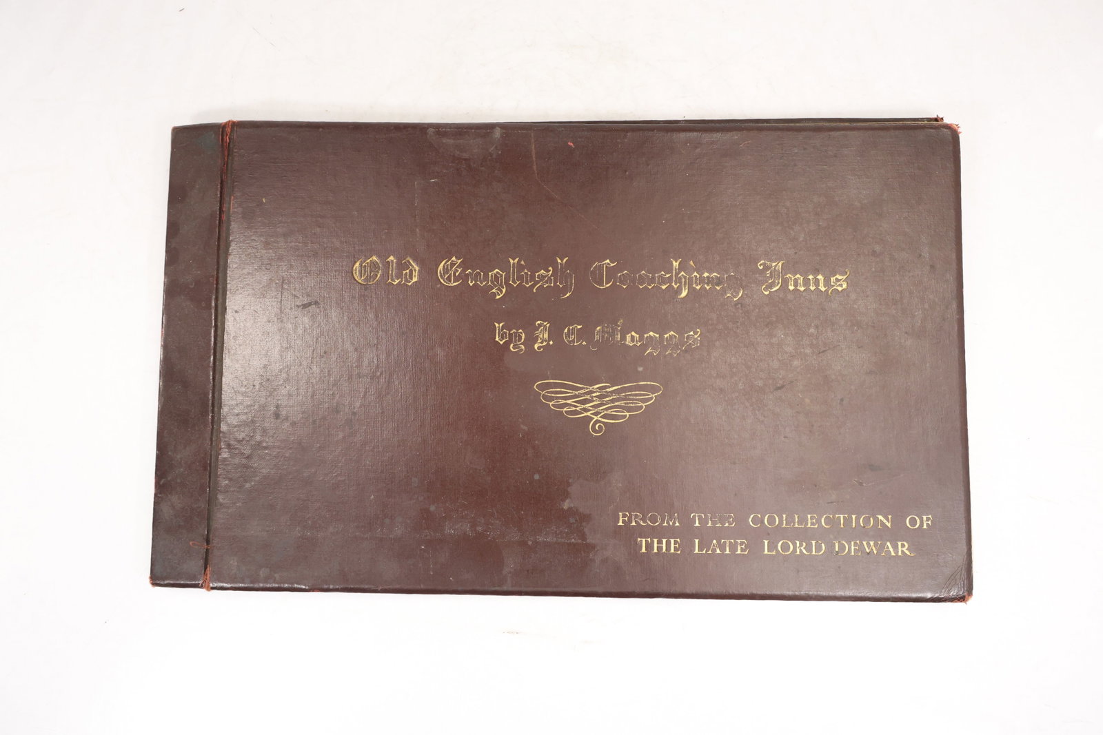 Old English Coaching Inns by J C Maggs Folio with Plates From the Collection of the Late Lord Dewar: Oblong folio volume titled Old English Coaching Inns by J C Maggs, bound in brown boards with gilt lettering on the cover and decorative flourish. The cover also reads From the Collection of the Late 
