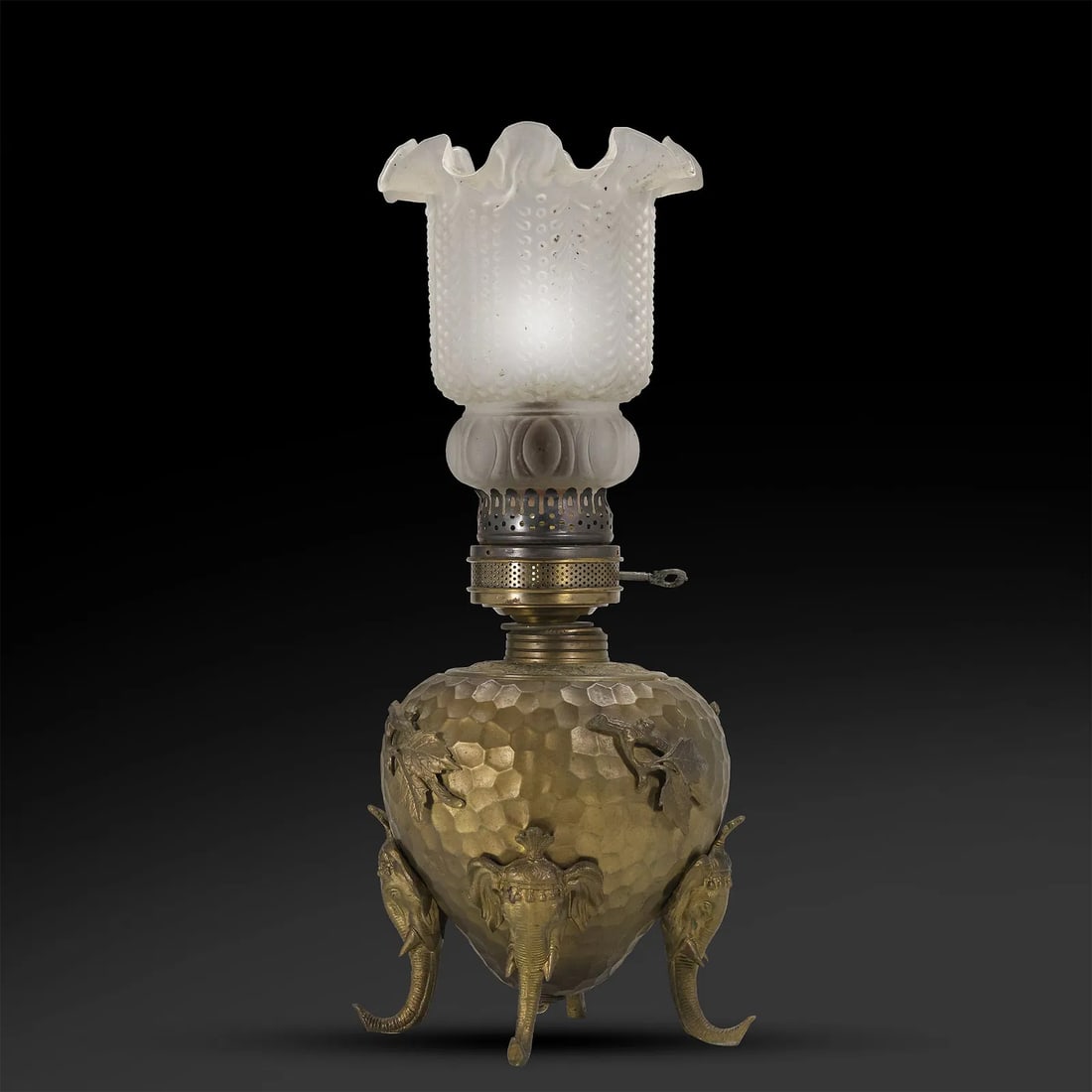 Victorian Aesthetic Movement Brass Honeycomb Table Lamp with Cast Elelphants Sides, Feet: Victorian Aesthetic Movement Brass Honeycomb Table Lamp with Cast Elelphants Sides, Feet. Satin Glass Shade. [note one elephant side casting the trunk is short] size: 21h 7.5w max 16h 6.5w base S:A** 