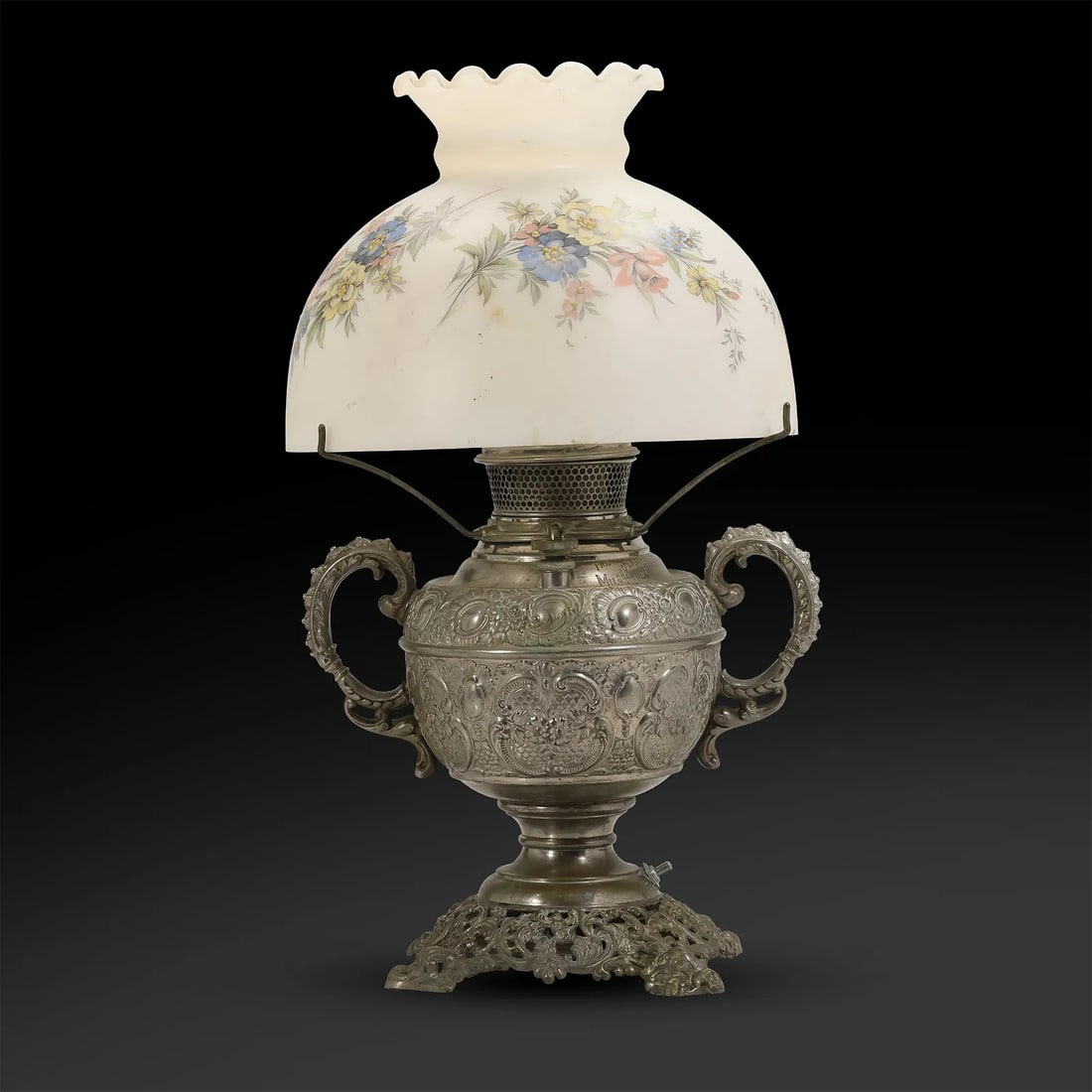 "THE MILLER LAMP" Victorian Nickle Plate Hurricane Lamp with Glass Shade: "THE MILLER LAMP" Victorian Nickle Plate Hurricane Lamp with Glass Shade. size:18h 10w max 15.5h 6.5w base S:A** Important Auction information:**** All lot descriptions in this auction were generated 