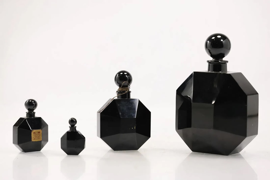 Set 4 D'ORSAY 'LE DANDY' BLACK GLASS BACCARAT PERFUMES in Graduated Sizes: Set 4 D'ORSAY 'LE DANDY' BLACK GLASS BACCARAT PERFUMES in Graduated Sizes/ original label. size: 7h 5w S:A** Important Auction information:**** All lot descriptions in this auction were generated usin